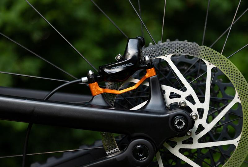 Oak Components Plasmadapt Brake Adapter, Post Mount, +23mm, Orange (incl. Titanium Mounting Hardware)